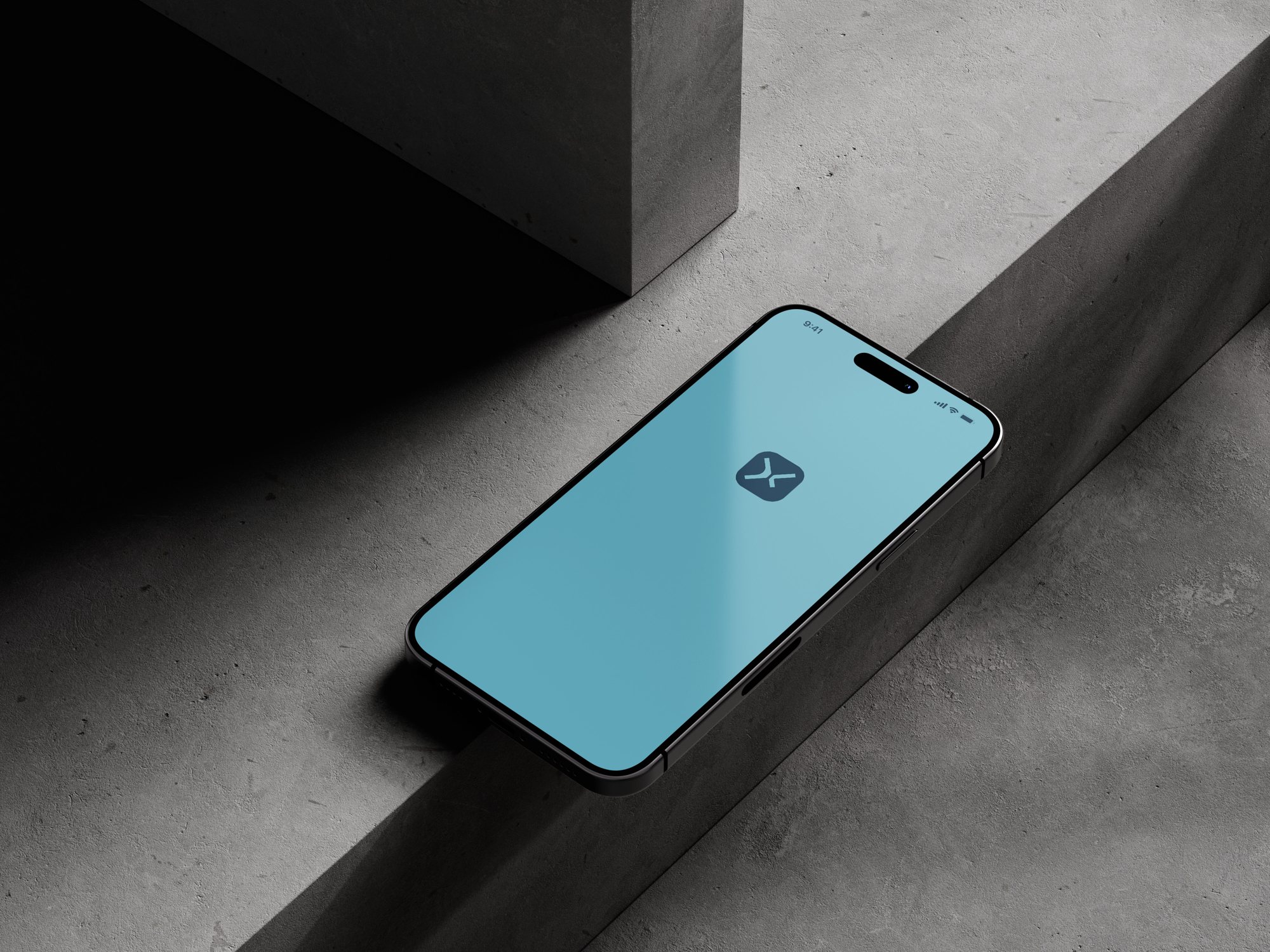 The app icon on a phone screen, in front of concrete