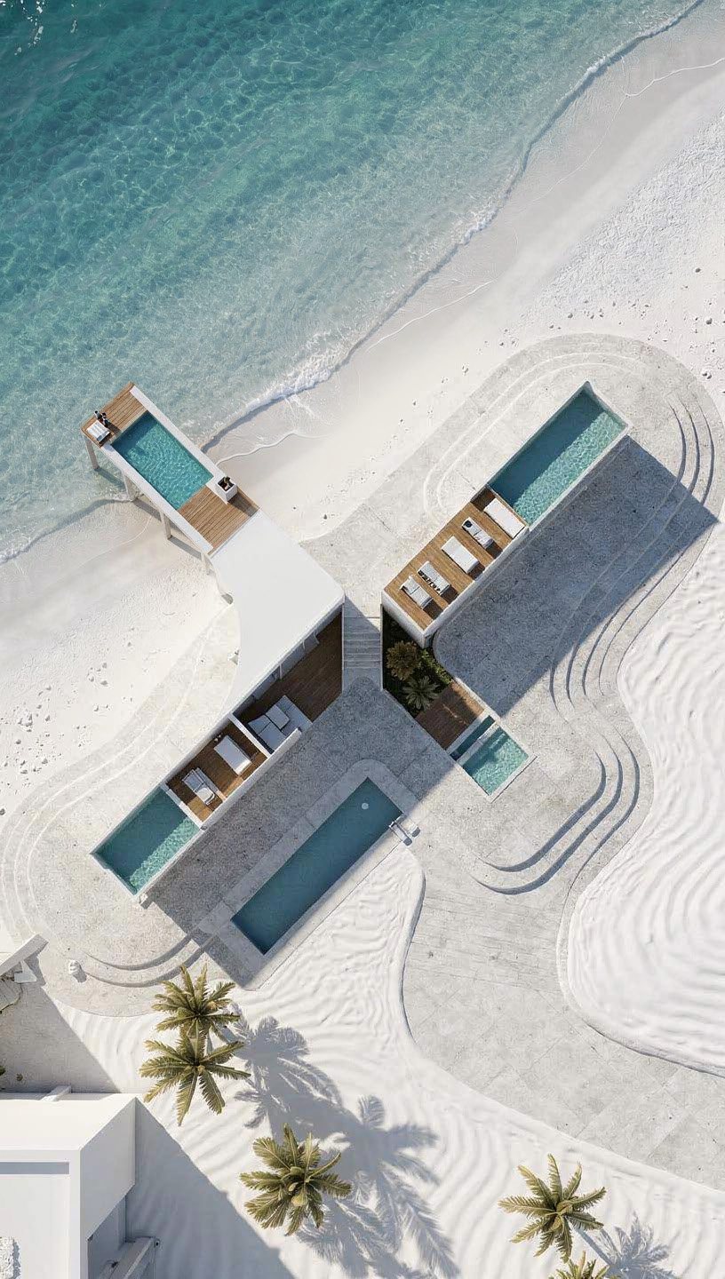 Aerial view of a beach villa and turquoise water